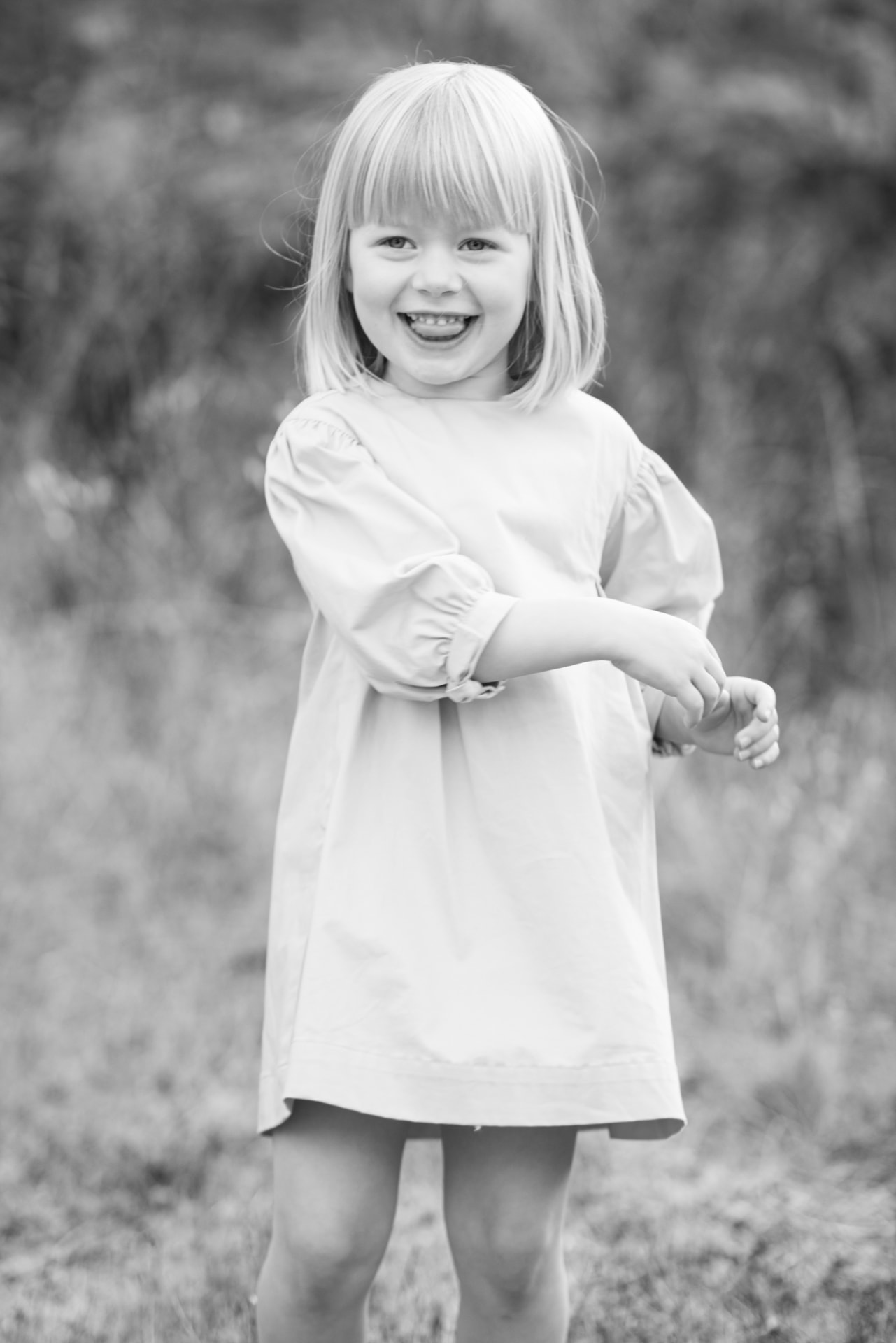 Portrait of a laughing young girl in soft outdoor light